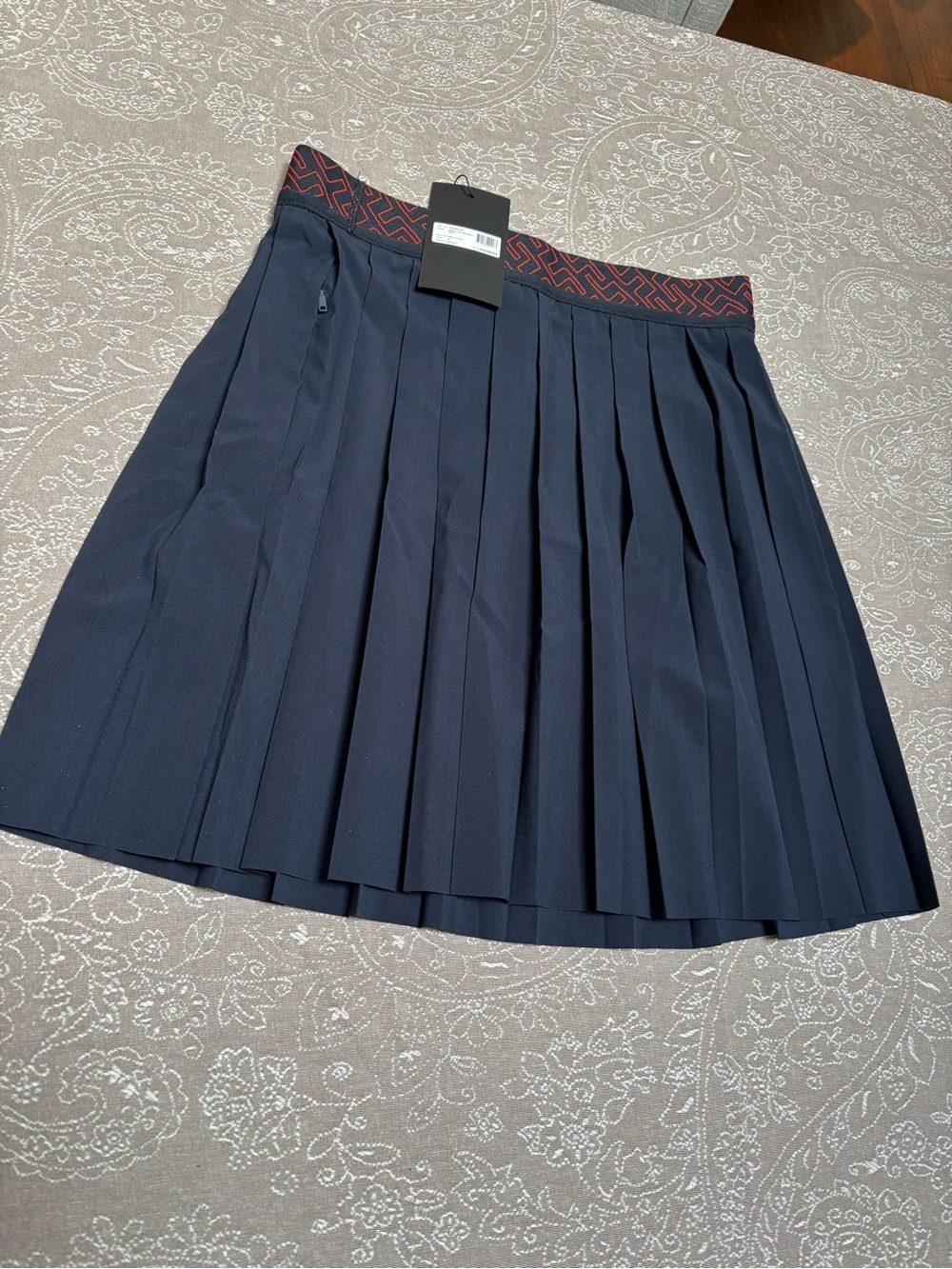 New J.Lindeberg Navy Pleated Mini Skirt with Red Trim Waistband